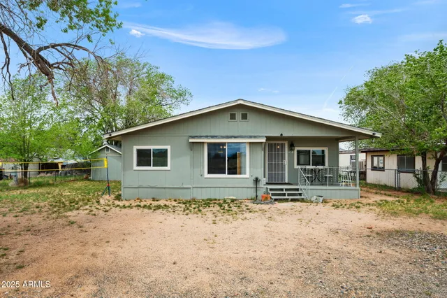 a house with trees in the background