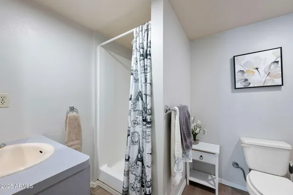a bathroom with a toilet a sink and bathtub