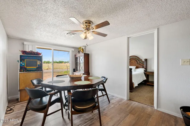 a view of a dining room with furniture and a chandelier