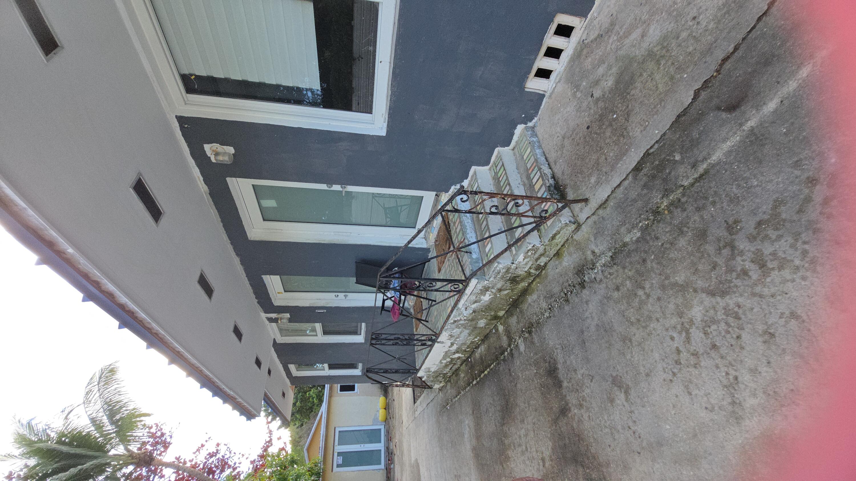 a view of two chairs in front of house