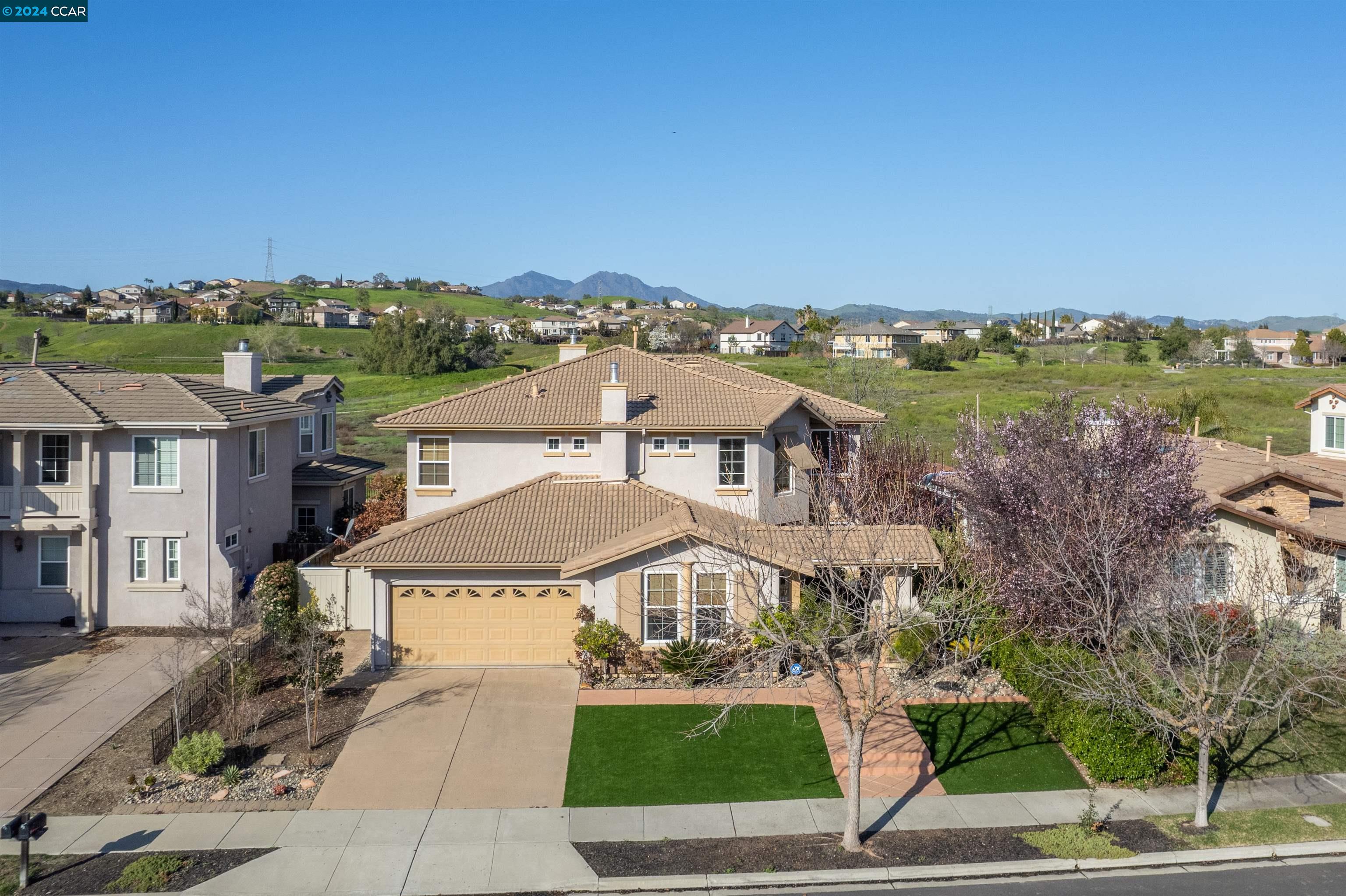 an aerial view of a house with a garden