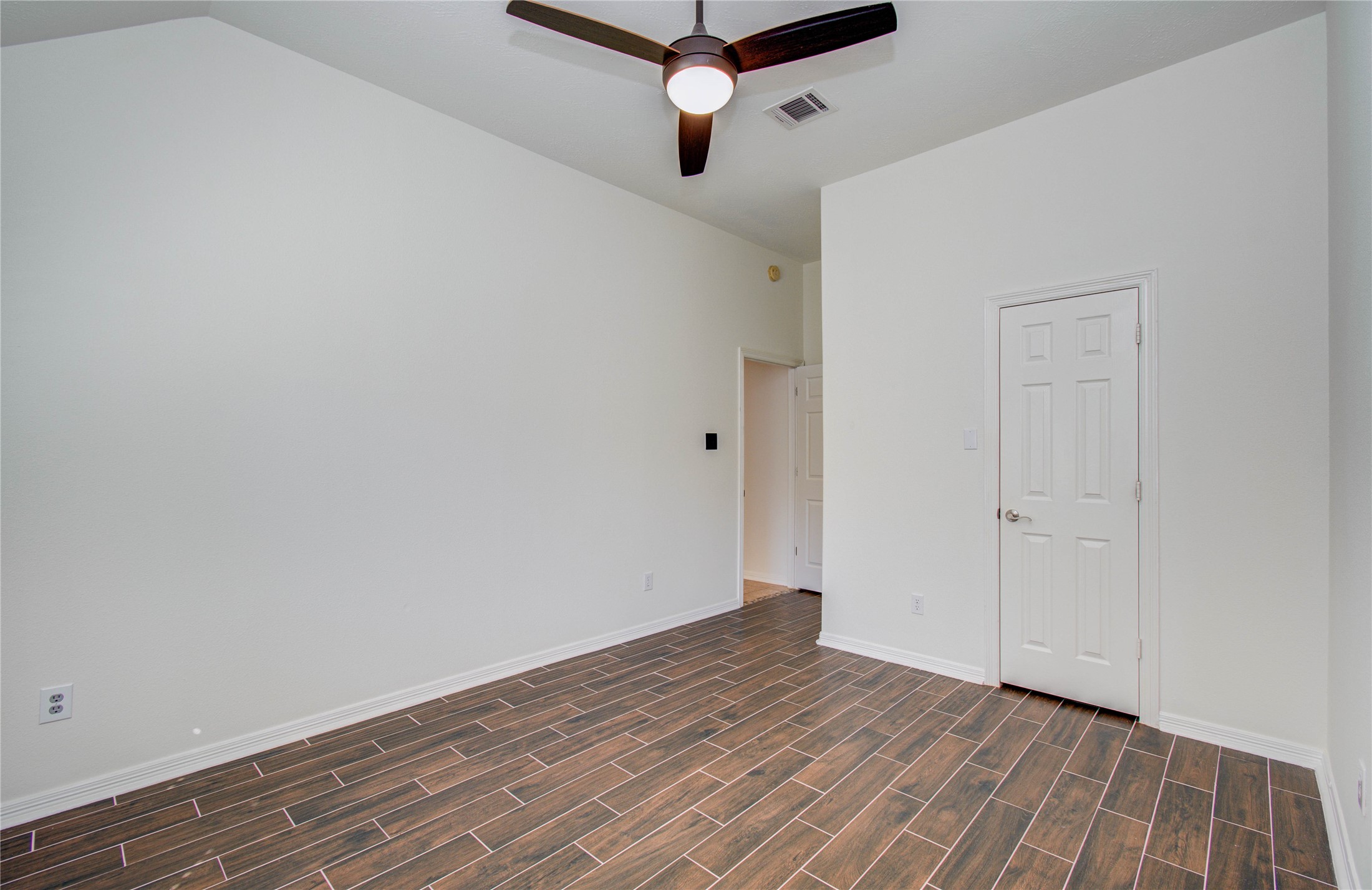 10714 Barker Lake Cypress, TX 77433 - Photo 14 of 43 a view of a room with wooden floor