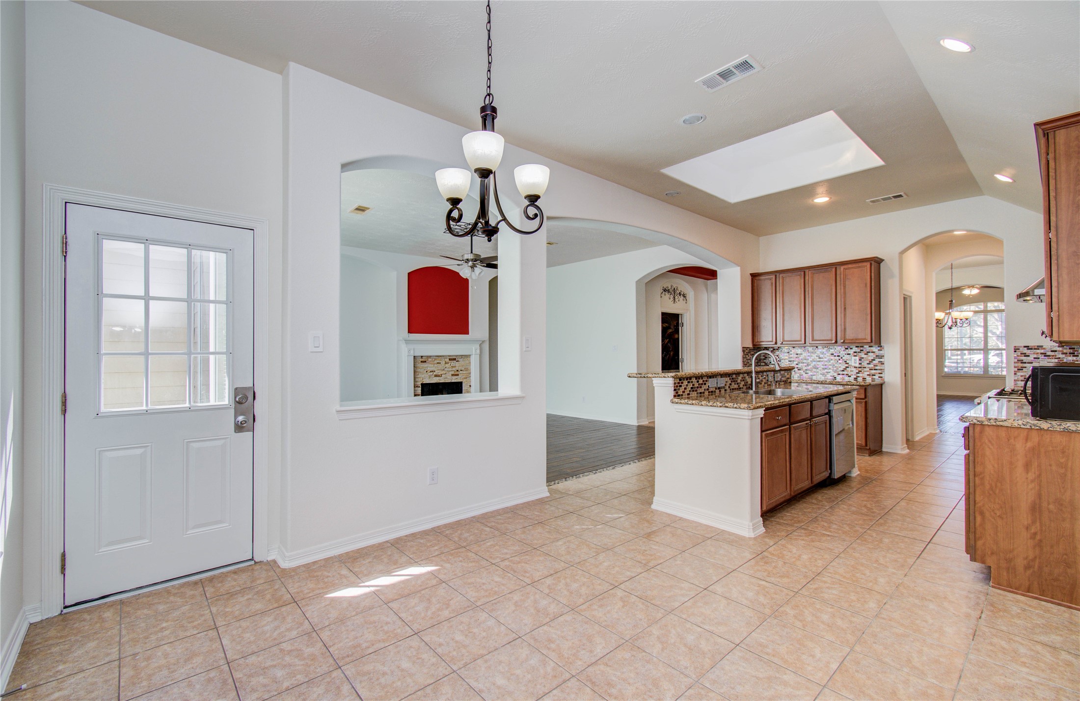 10714 Barker Lake Cypress, TX 77433 - Photo 30 of 43 a large kitchen with cabinets and stainless steel appliances