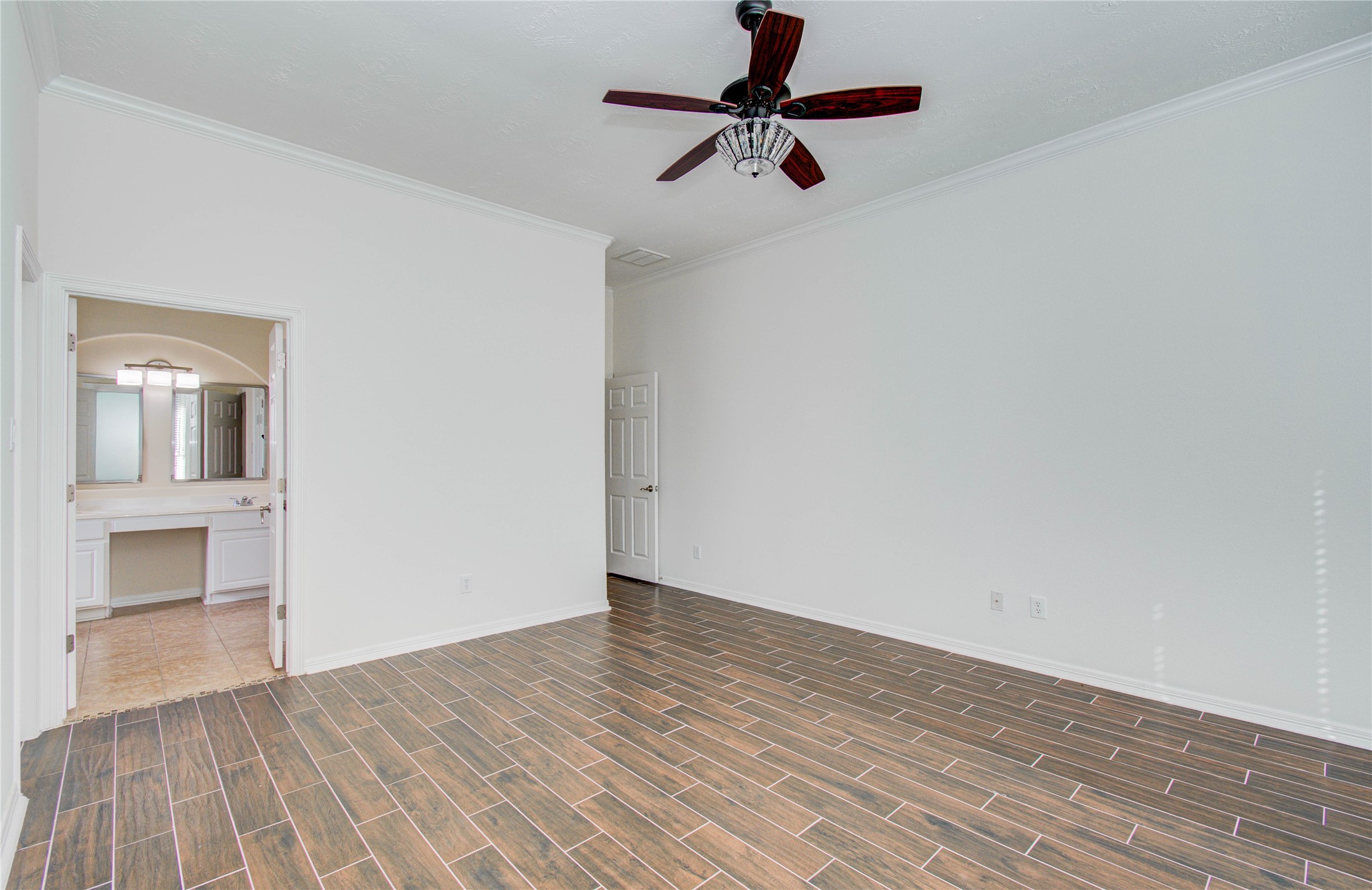 10714 Barker Lake Cypress, TX 77433 - Photo 34 of 43 a view of an empty room and wooden floor