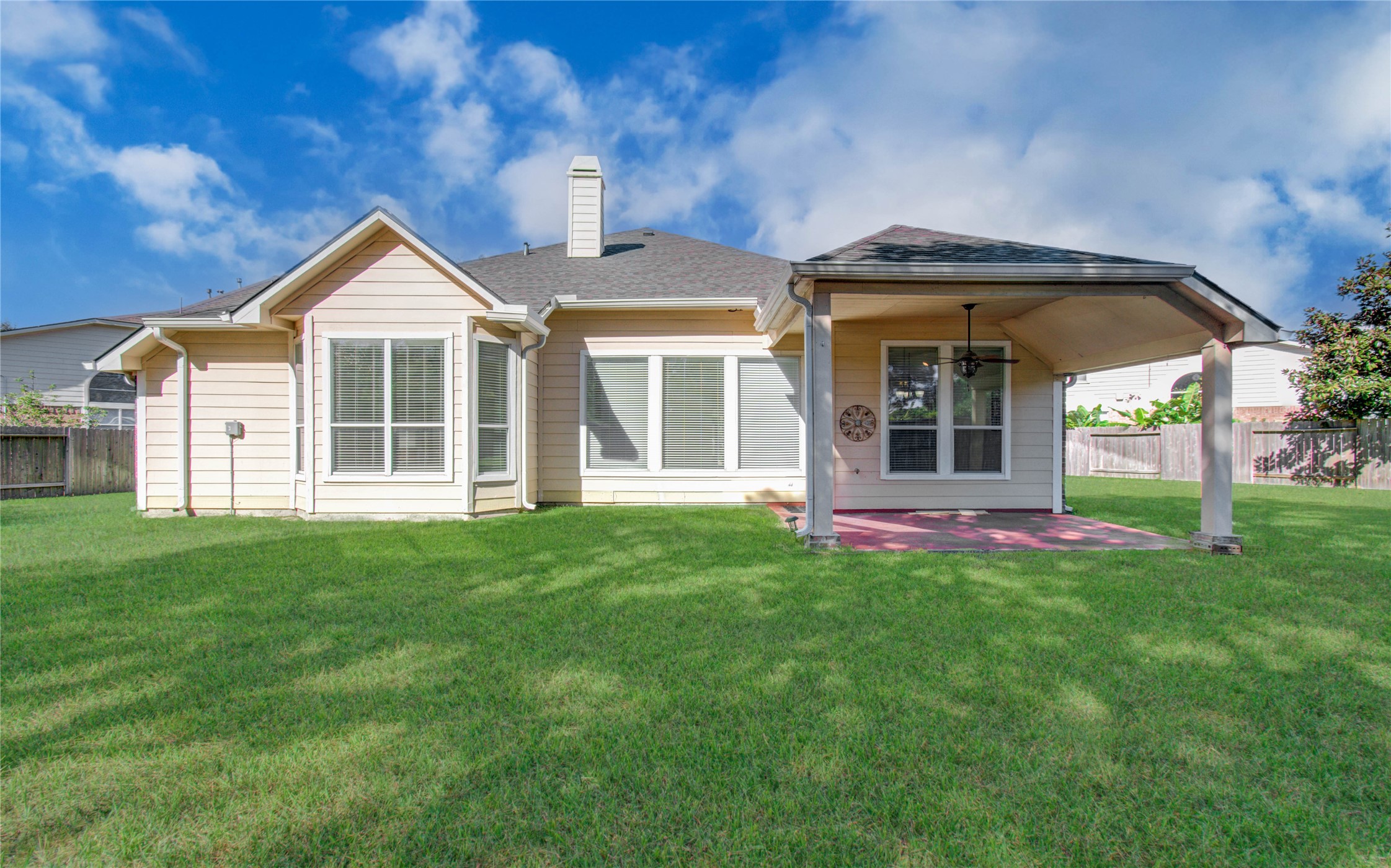 10714 Barker Lake Cypress, TX 77433 - Photo 40 of 43 a front view of a house with a yard and trees