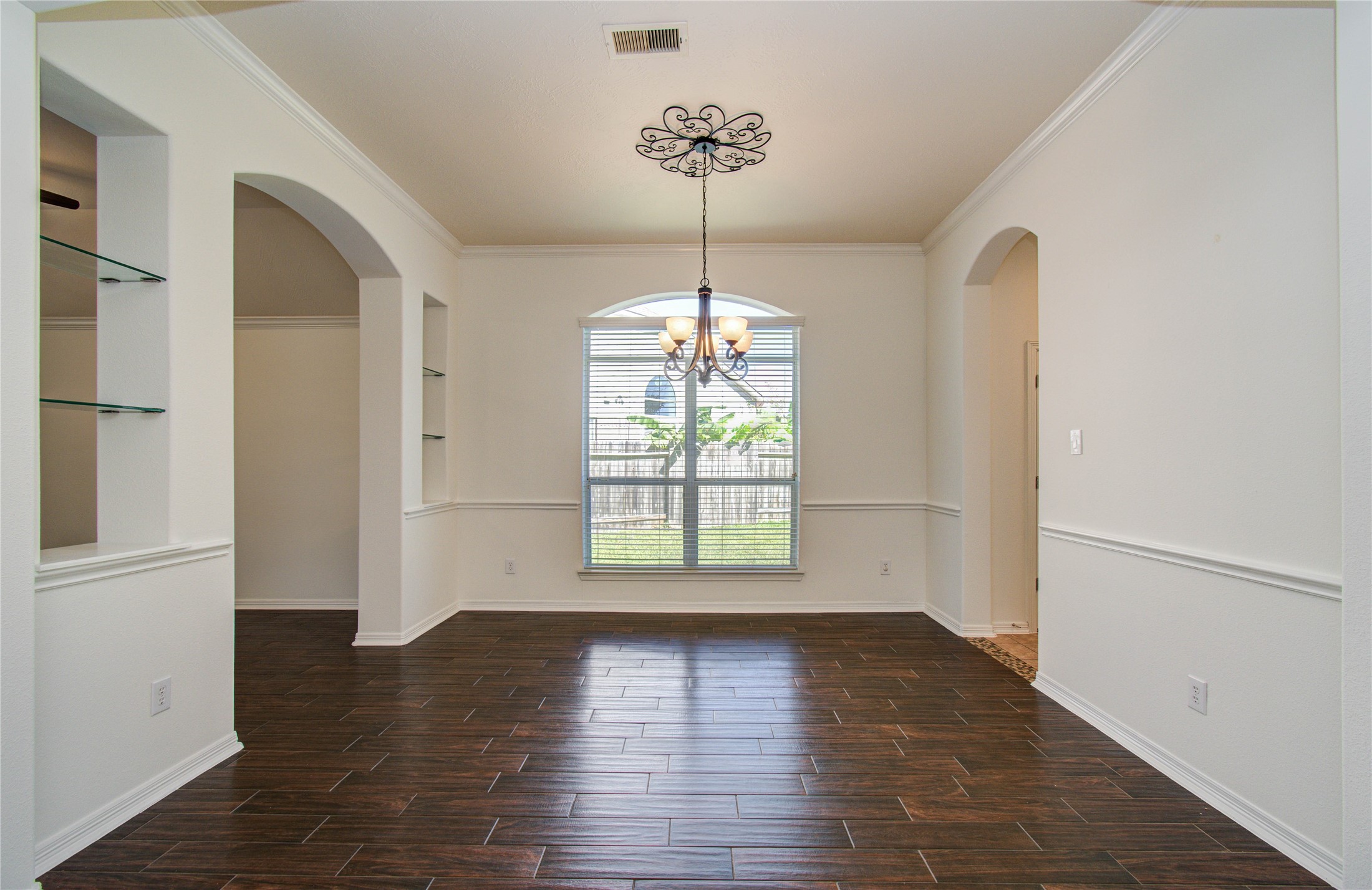 10714 Barker Lake Cypress, TX 77433 - Photo 8 of 43 a view of an empty room with window and wooden floor
