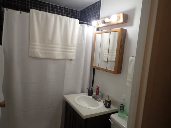a bathroom with a sink and mirror