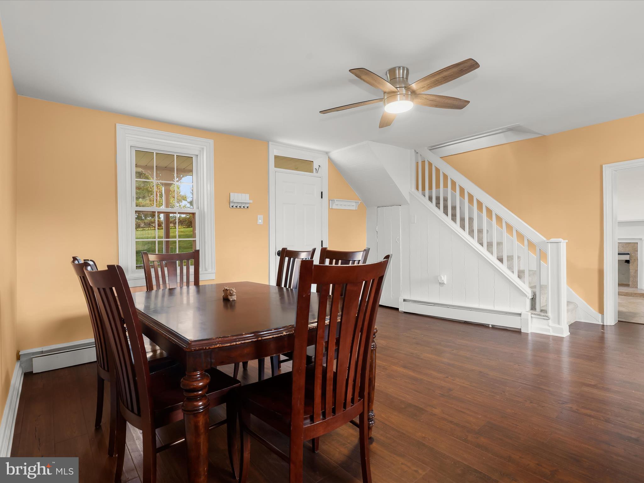 1530 Bowersox Road New Windsor, MD 21776 - Photo 11 of 97 a view of a dining room with furniture window and wooden floor
