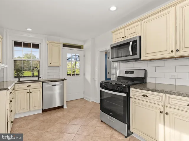 a bathroom with a sink a vanity and mirror