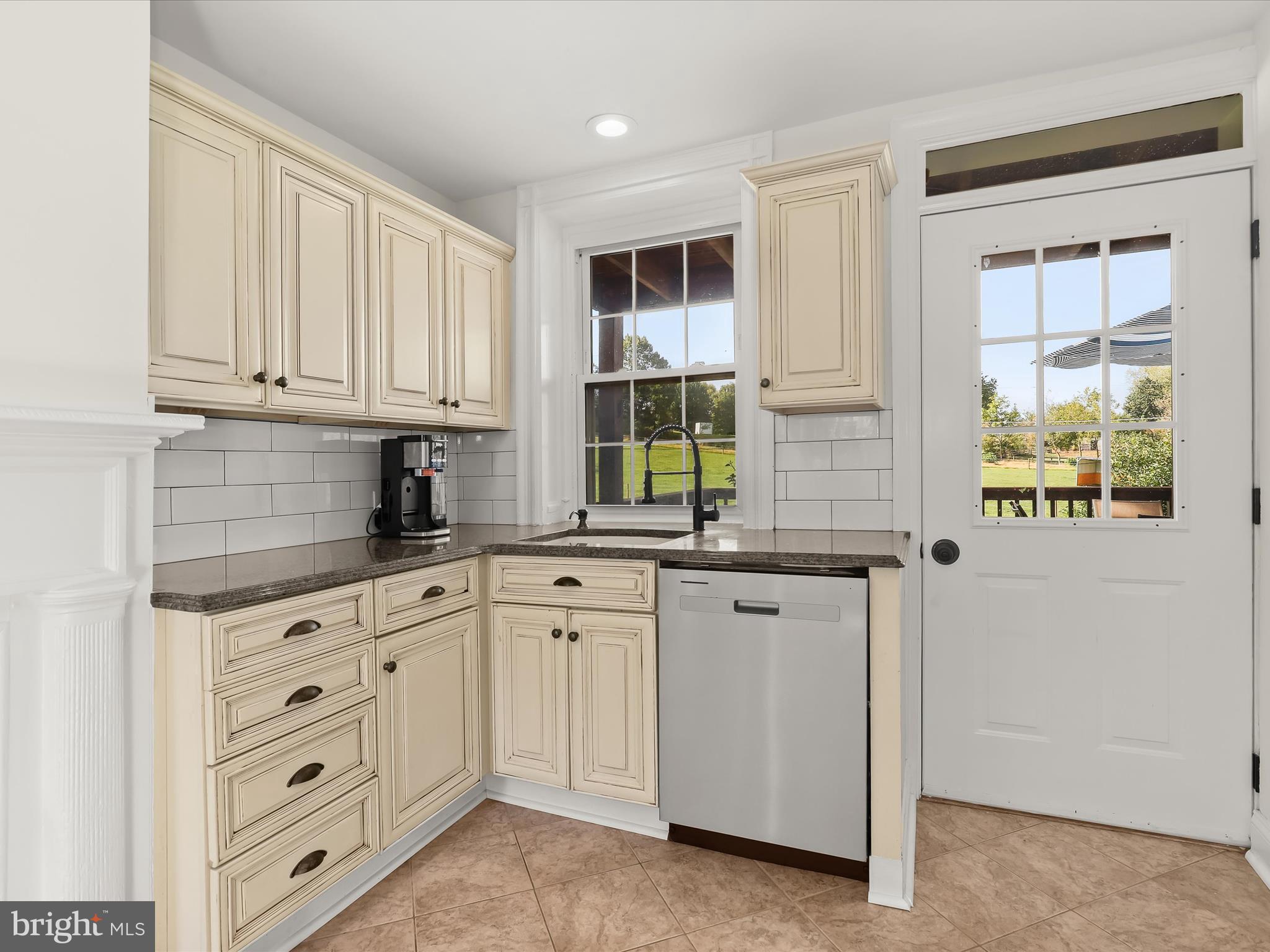 1530 Bowersox Road New Windsor, MD 21776 - Photo 15 of 97 a kitchen with cabinets appliances a sink and a window