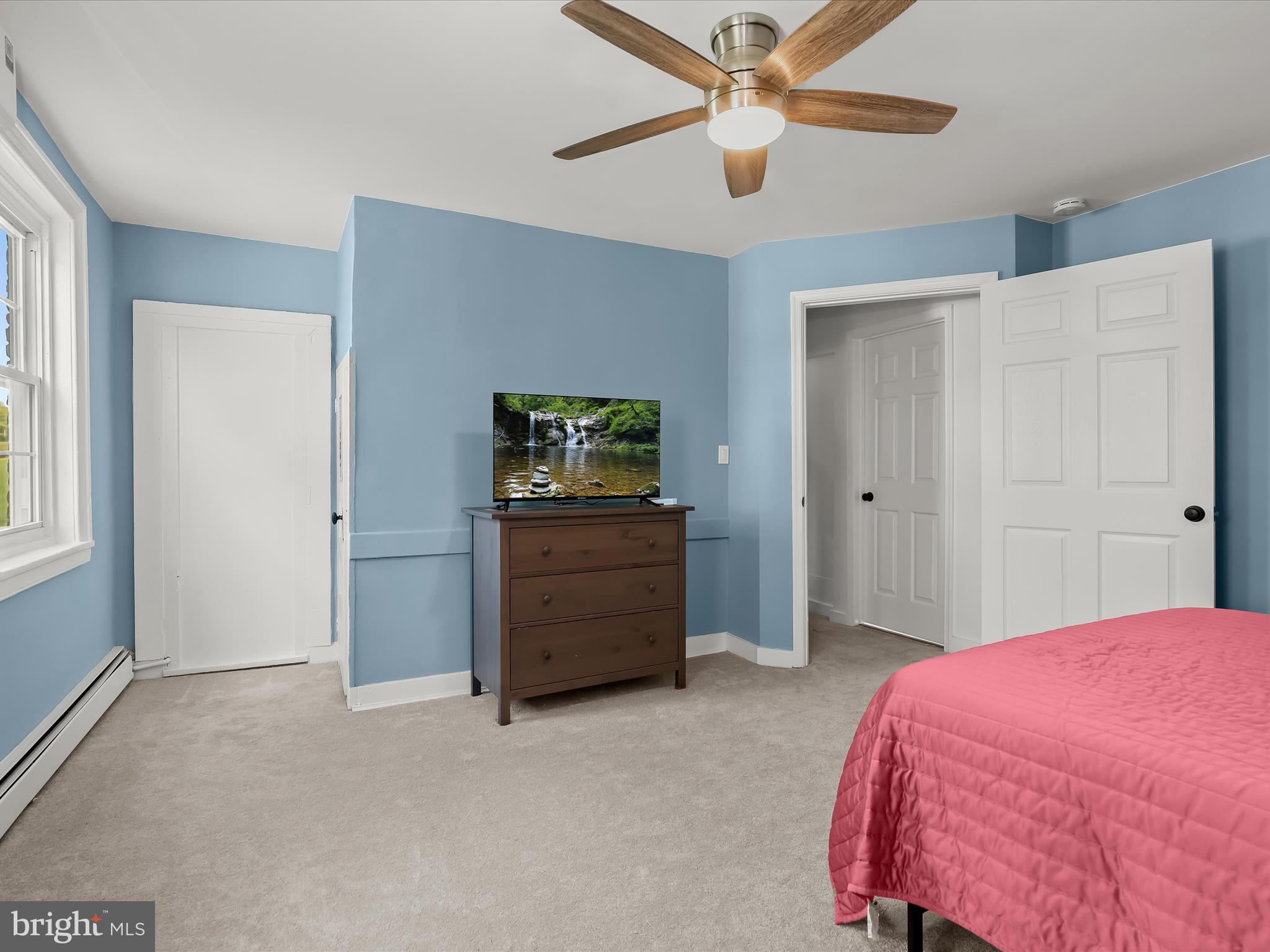 1530 Bowersox Road New Windsor, MD 21776 - Photo 19 of 97 a bedroom with a bed and a chandelier