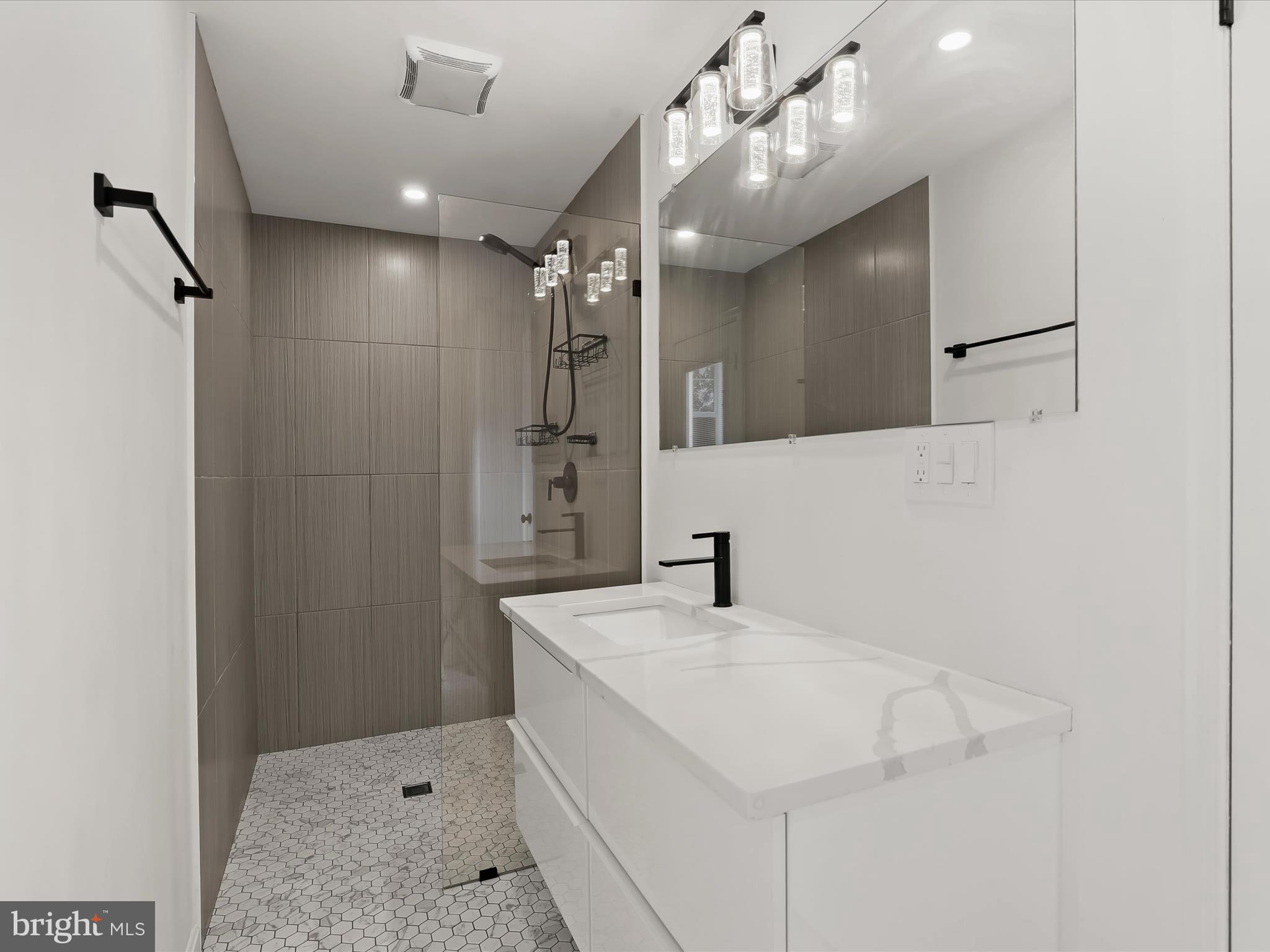 1530 Bowersox Road New Windsor, MD 21776 - Photo 20 of 97 a bathroom with a sink a vanity and mirror