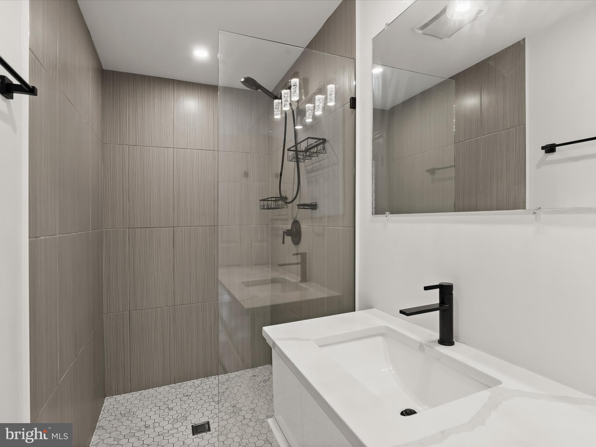 1530 Bowersox Road New Windsor, MD 21776 - Photo 22 of 97 a bathroom with a sink a shower and a mirror