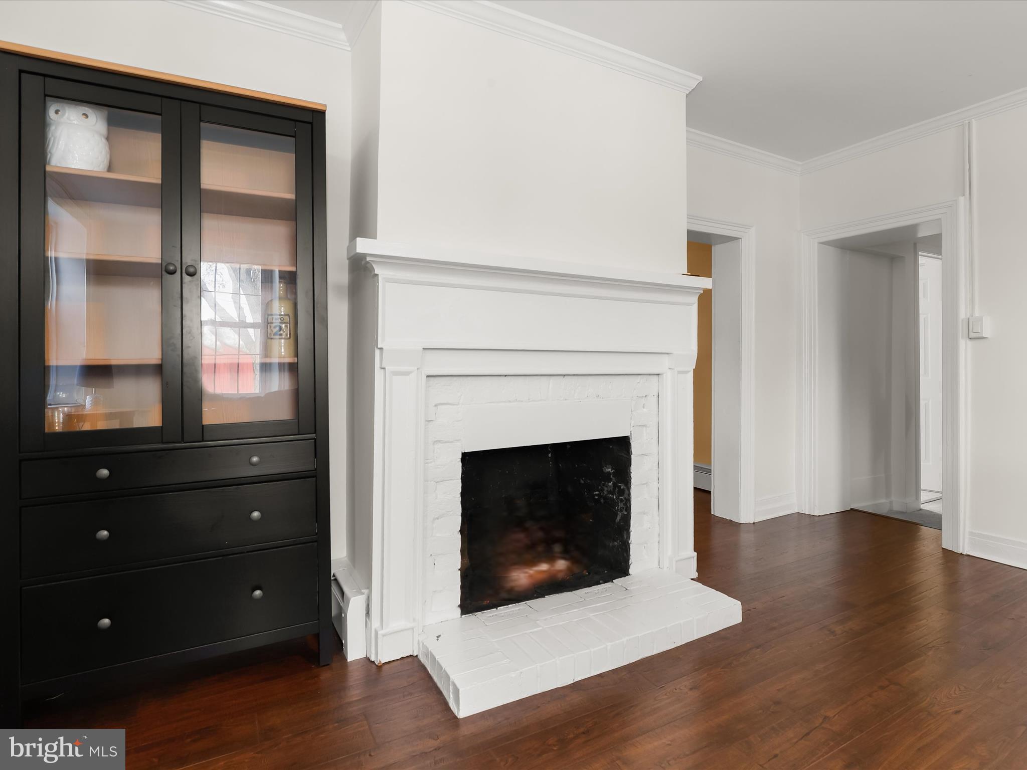 1530 Bowersox Road New Windsor, MD 21776 - Photo 7 of 97 a living room with wooden floors and a fireplace