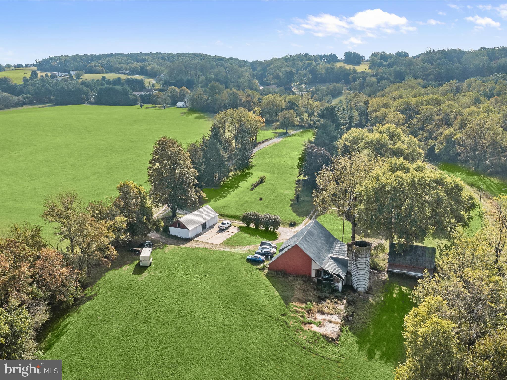 1530 Bowersox Road New Windsor, MD 21776 - Photo 85 of 97 an aerial view of a house with a garden and lake view