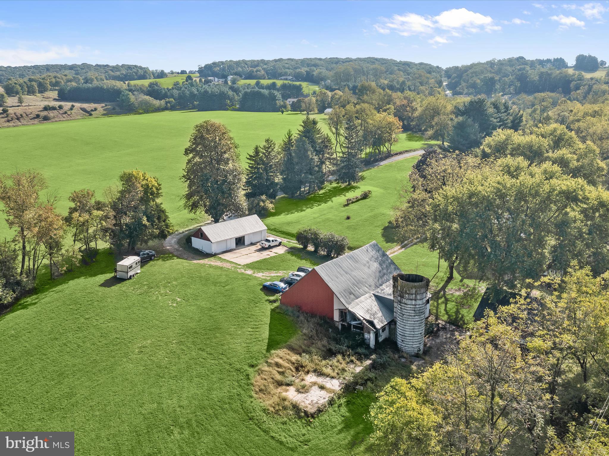 1530 Bowersox Road New Windsor, MD 21776 - Photo 88 of 97 an aerial view of green landscape with trees houses and mountain view