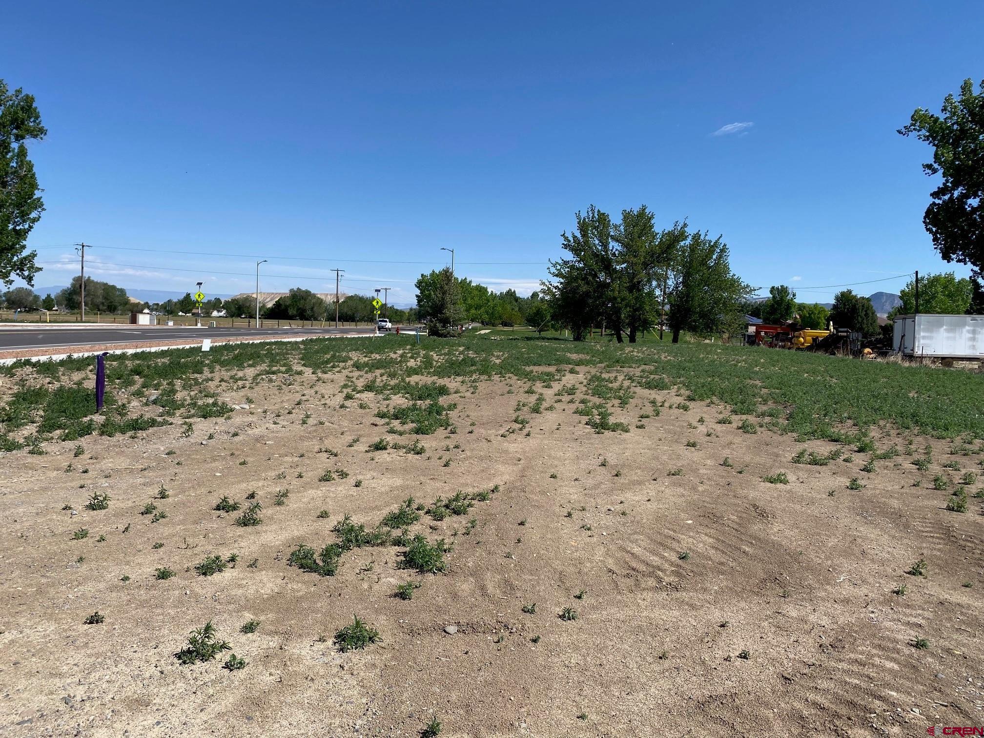 Lot 7 6700th Road Montrose, CO 81401 - Photo 8 of 8 a view of a lake with a yard