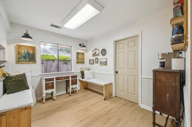 a view of a livingroom with furniture and windows