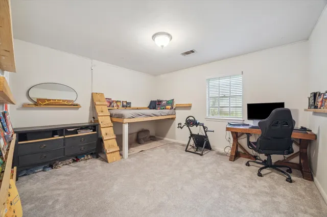 a view of a workspace with furniture