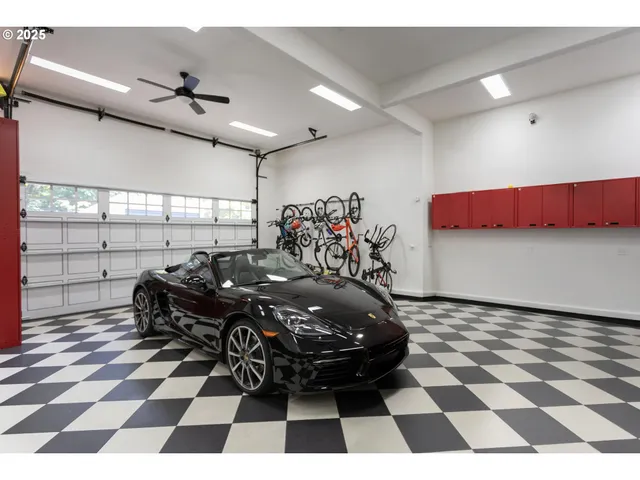 a dining room with wooden floor a chandelier a wooden table and chairs