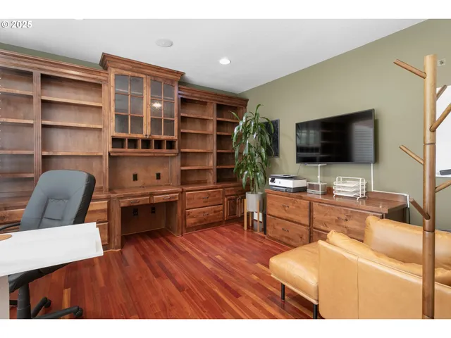 a view of an entryway with wooden floor and stairs