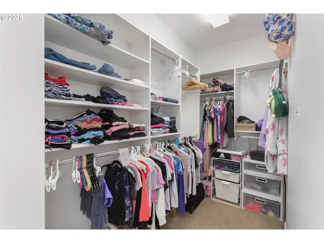 a bathroom with a sink a mirror and a shower