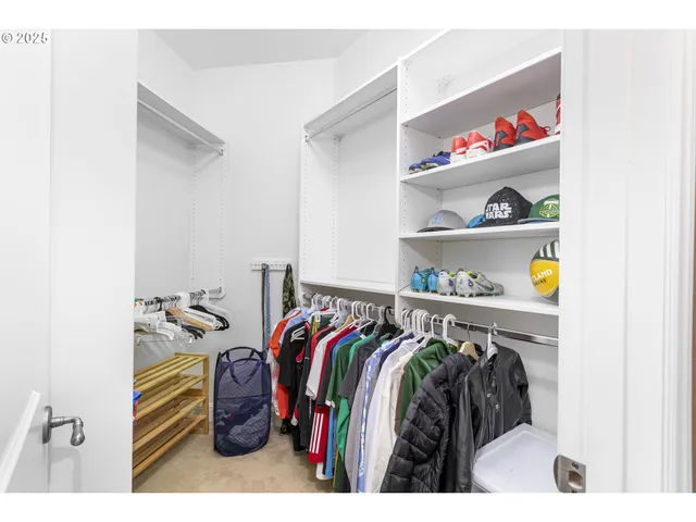 a bathroom with a granite countertop sink a toilet and a mirror