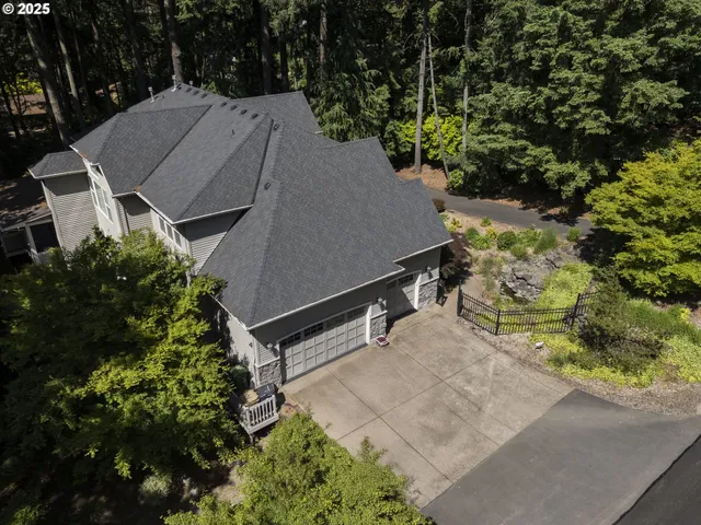 an aerial view of a house with yard barbeque oven and outdoor seating