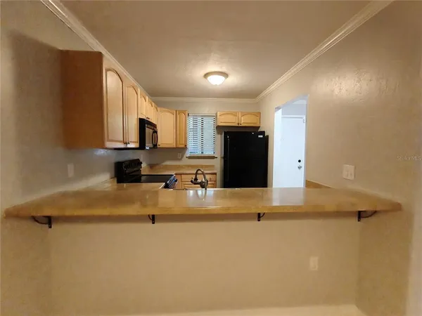 a view of a kitchen with a sink