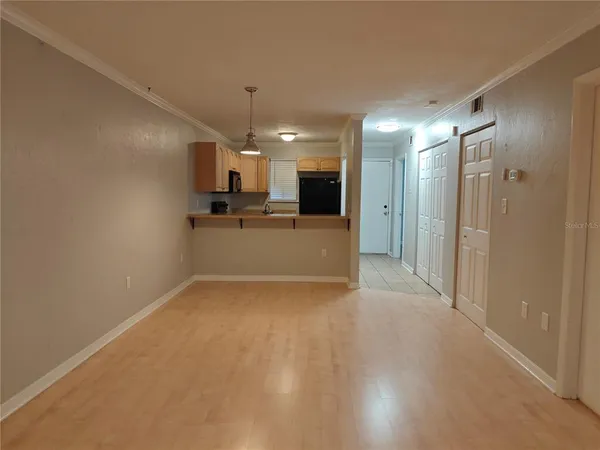 a view of a kitchen with a sink and a refrigerator