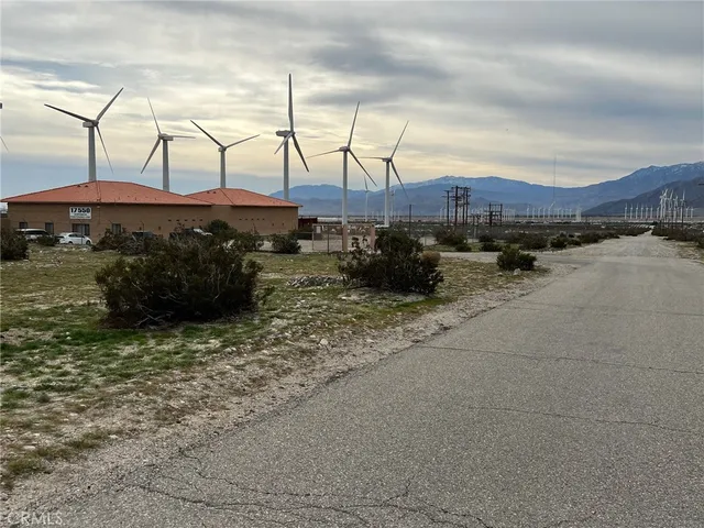 a view of a street with a building in the background