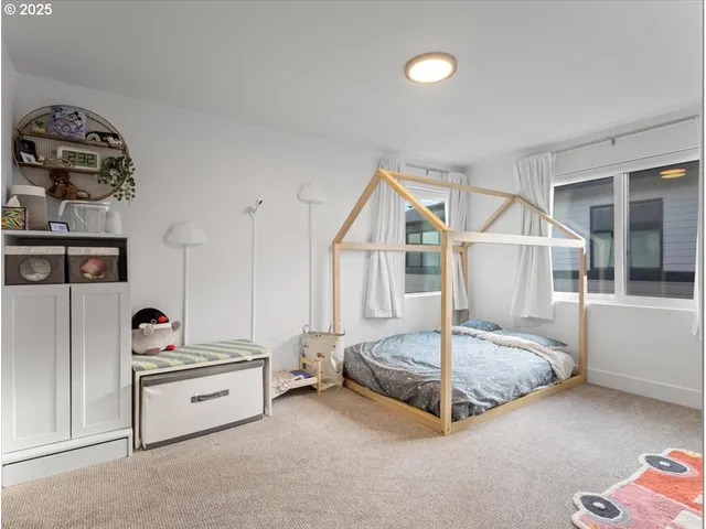 a bed room with a bed and a window