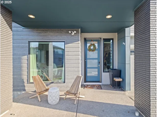 a bedroom with a bed and glass door