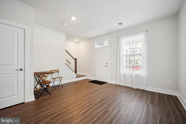 a view of room with wooden floor