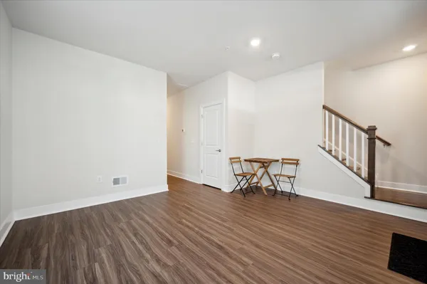 a bathroom with a sink toilet and window