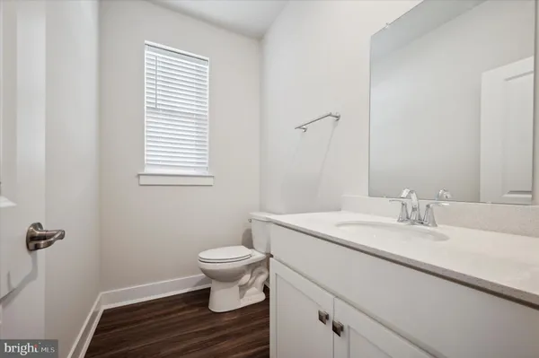 a view of kitchen with cabinets and wooden floor