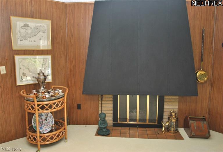 340 Tremont Road Akron, OH 44313 - Photo 7 of 25 Accenting another corner of the family room is a dramatic gas log fireplace.