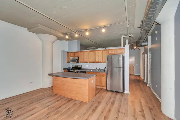 a kitchen with stainless steel appliances granite countertop a stove and a sink