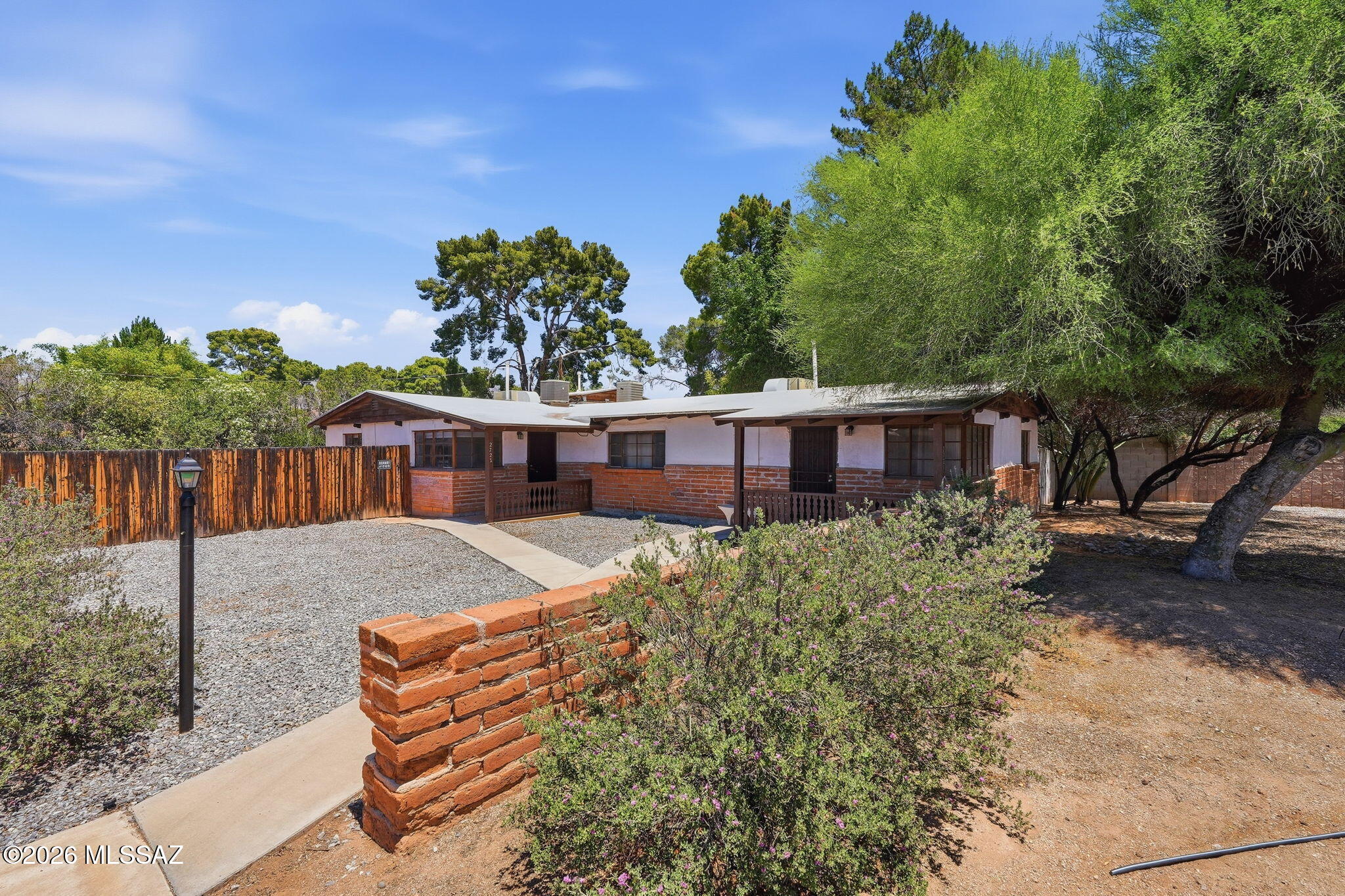 2721 East Fort Lowell Road Tucson, AZ 85716 - Photo 1 of 28 a view of a house with a yard