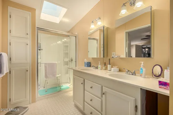 a bathroom with a double vanity sink mirror and double