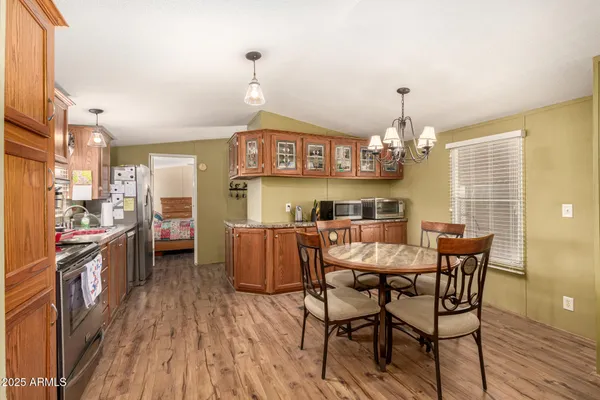 a view of a dining room with furniture and wooden floor