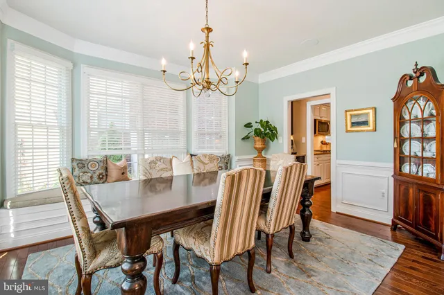 a view of a dining room with furniture and a window