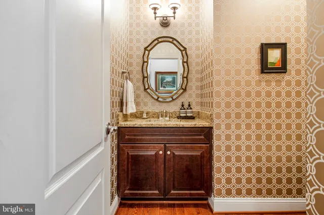a bathroom with a mirror and a sink