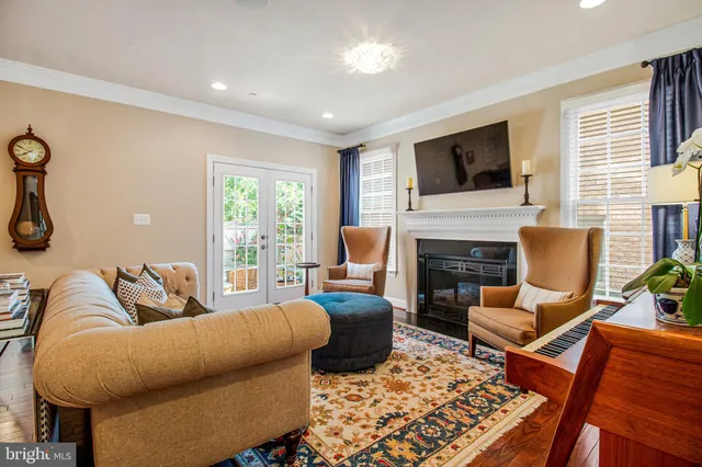 a living room with furniture fireplace and flat screen tv