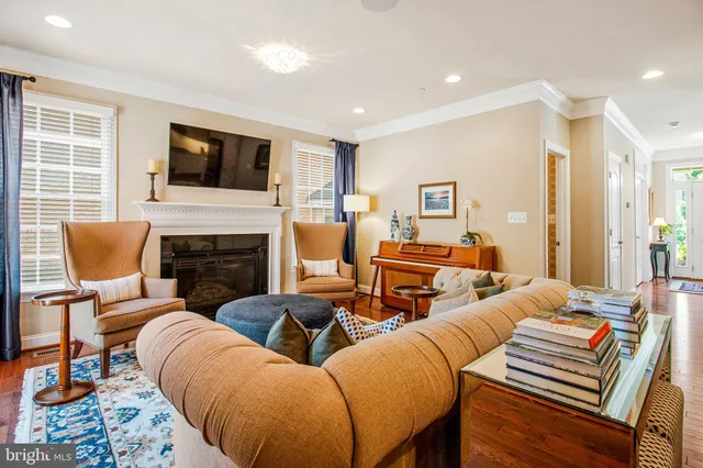 a living room with furniture fireplace and flat screen tv