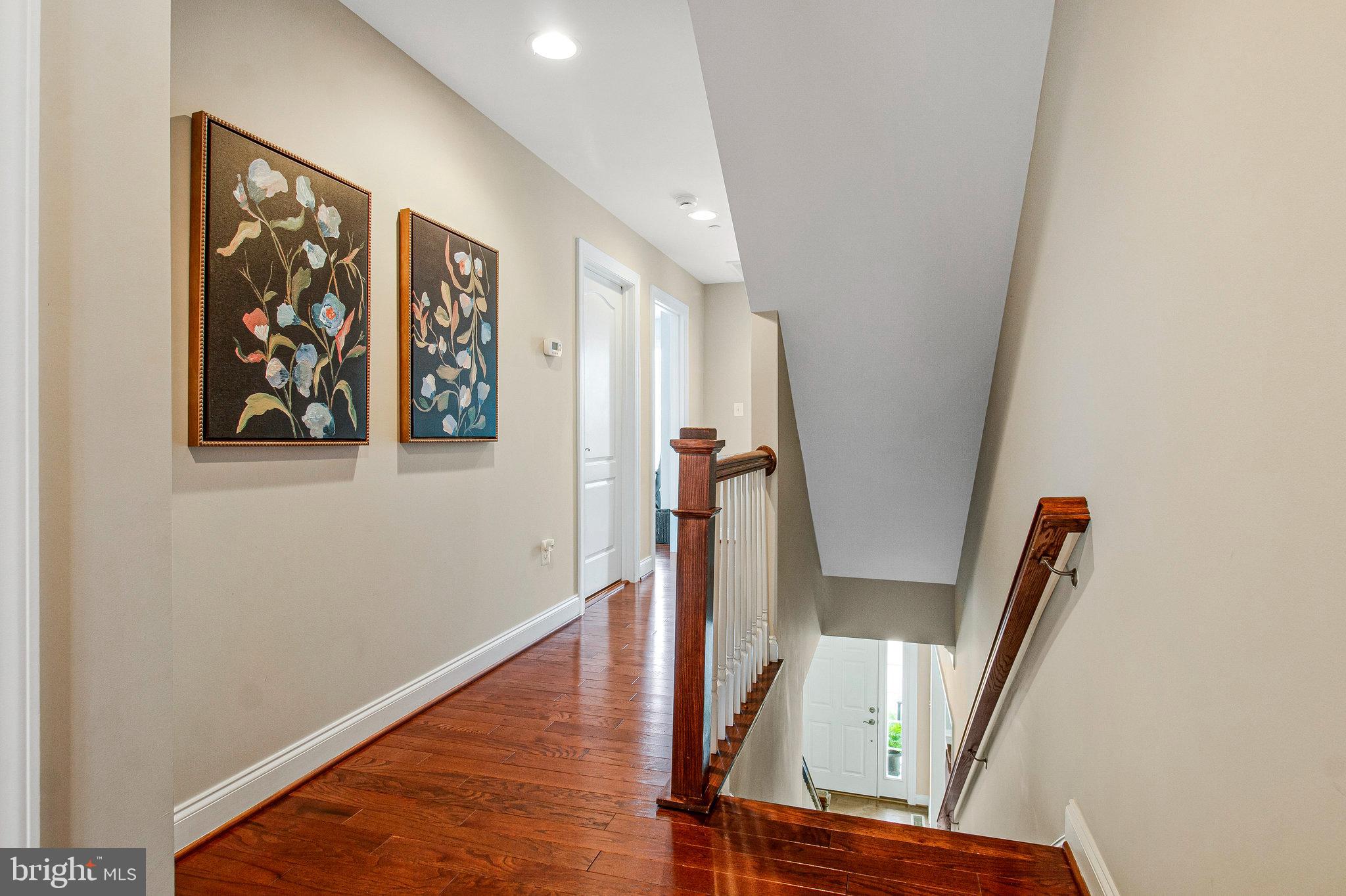 208 Beacon Place Northeast Washington, DC 20011 - Photo 23 of 48 a view of a hallway with wooden floor and stairs
