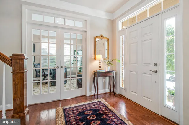 a room with wooden floor and a porch
