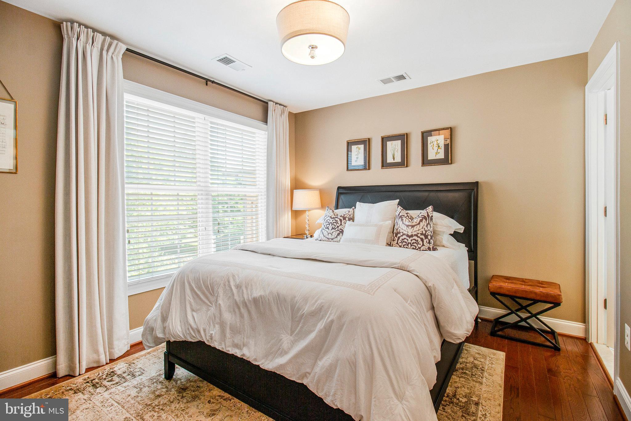 208 Beacon Place Northeast Washington, DC 20011 - Photo 31 of 48 a bedroom with a bed and a window