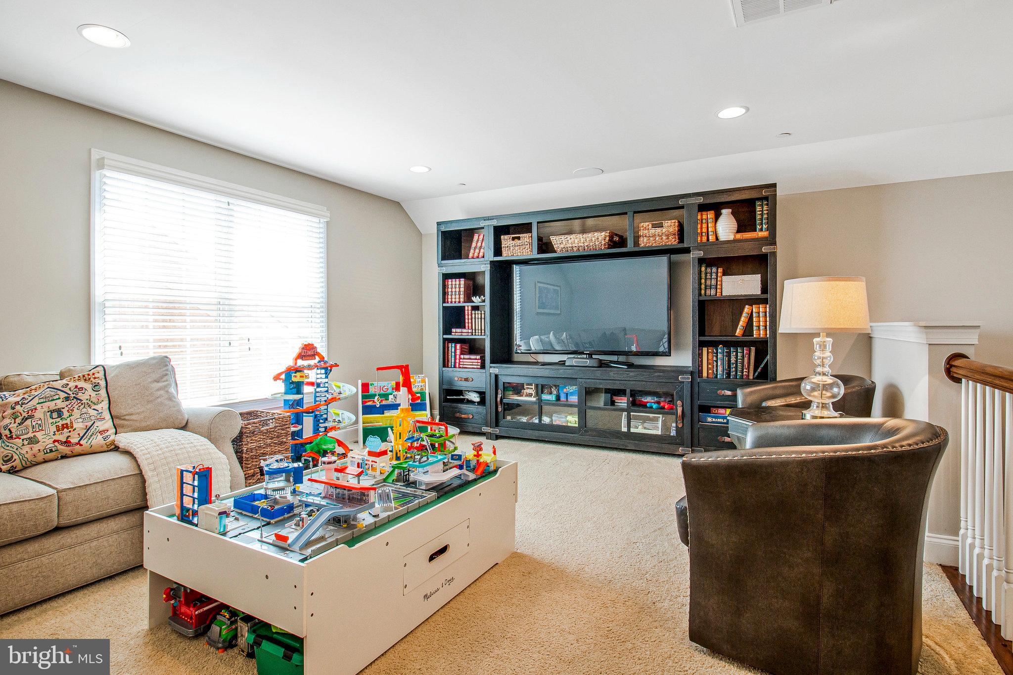 208 Beacon Place Northeast Washington, DC 20011 - Photo 46 of 48 a living room with furniture and a flat screen tv