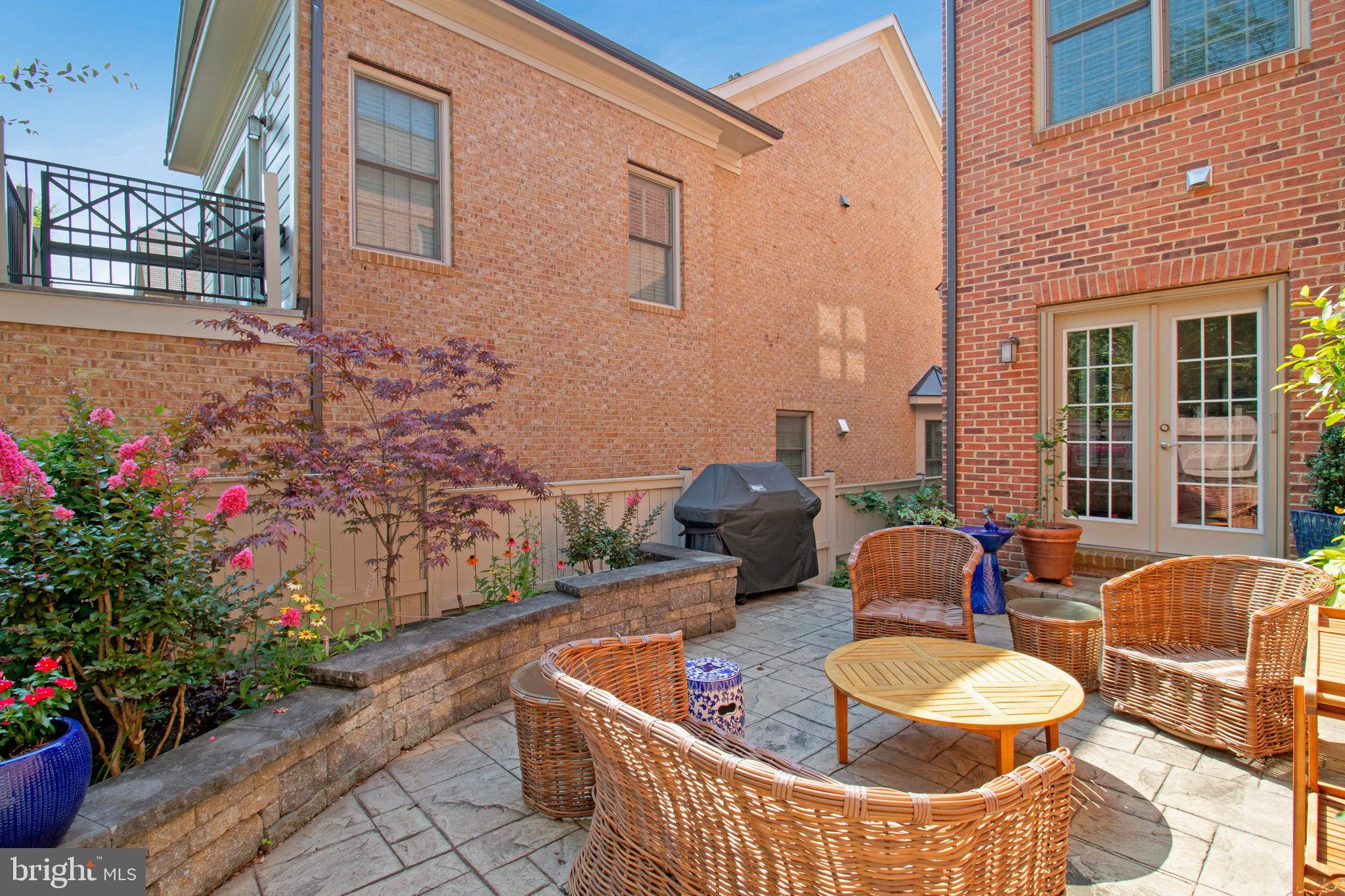208 Beacon Place Northeast Washington, DC 20011 - Photo 47 of 48 a view of a patio with couches table and chairs and potted plants